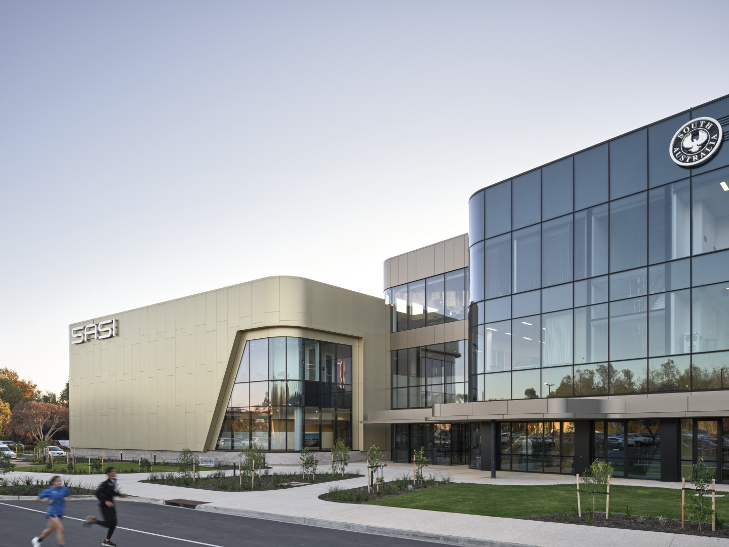 Clad facade and curved glazing of SASI, the South Australian Sports Institute, Mile End
